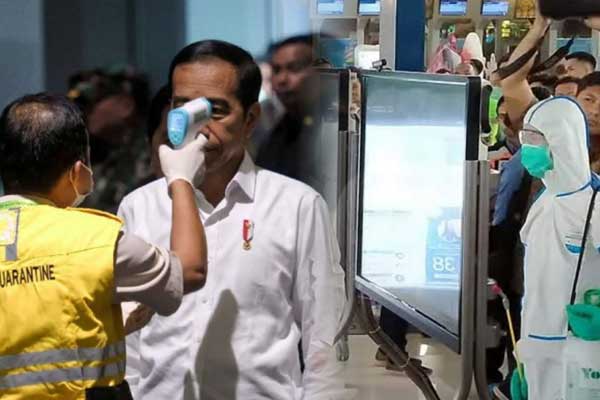 CEK SUHU TUBUH: Petugas mengecek suhu tubuh Presiden Joko Widodo saat meninjau fasilitas di Terminal 3 Bandara Soekarno-Hatta guna mencegah penyebaran virus COVID-19, Jumat (13/3).