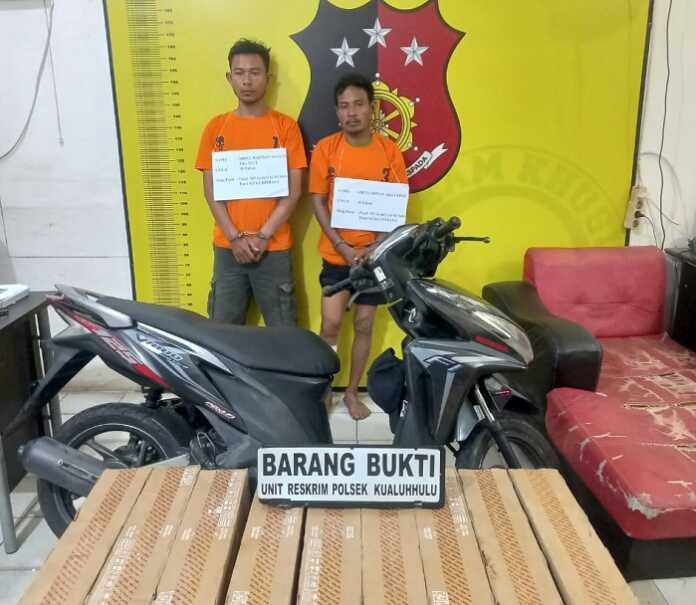 DIAMANKAN: Kedua bajing loncat diamankan Polsek Kualuh Hulu berikut barang bukti yang dicuri. HONGKY/SUMUT POS