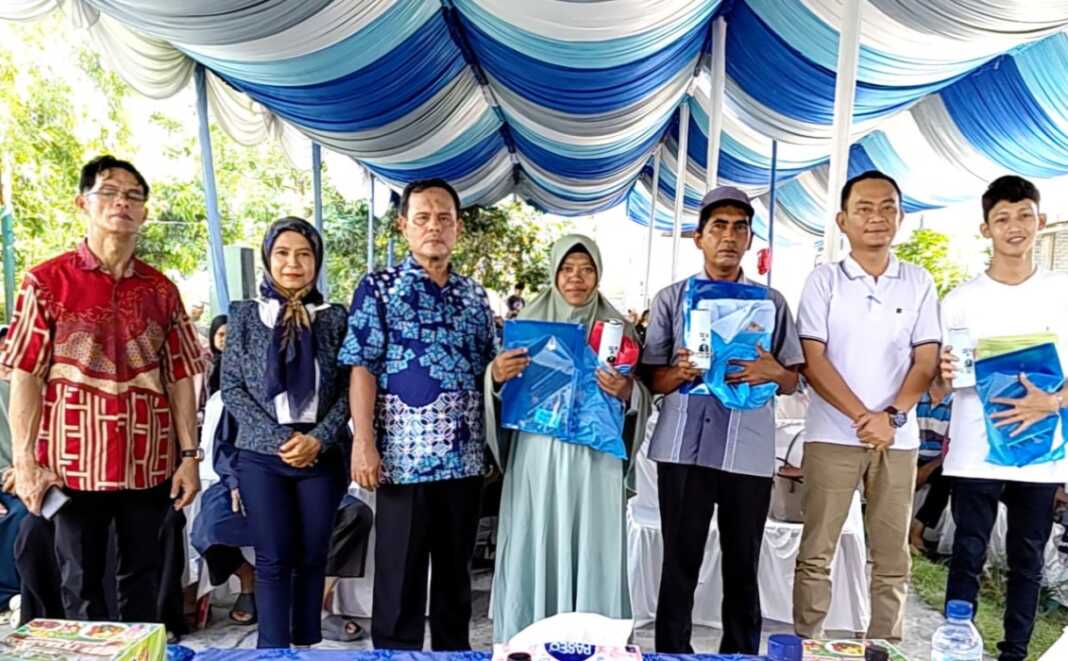 SOSIALISASI: H. Muslim MSP saat sosialisasi Perda tentang Pengelolaan Persampahan di Medan Marelan, Minggu (10/4/2026)